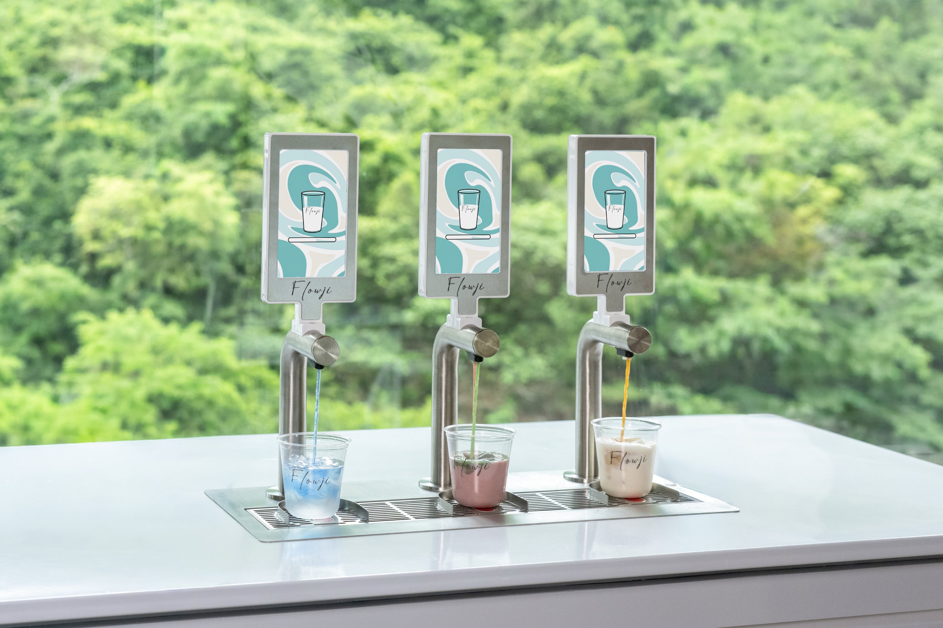 Hong Kong Flowji beverage cart dispensing handcrafted drinks into branded cups, showcasing live beverage preparation with three automated taps.