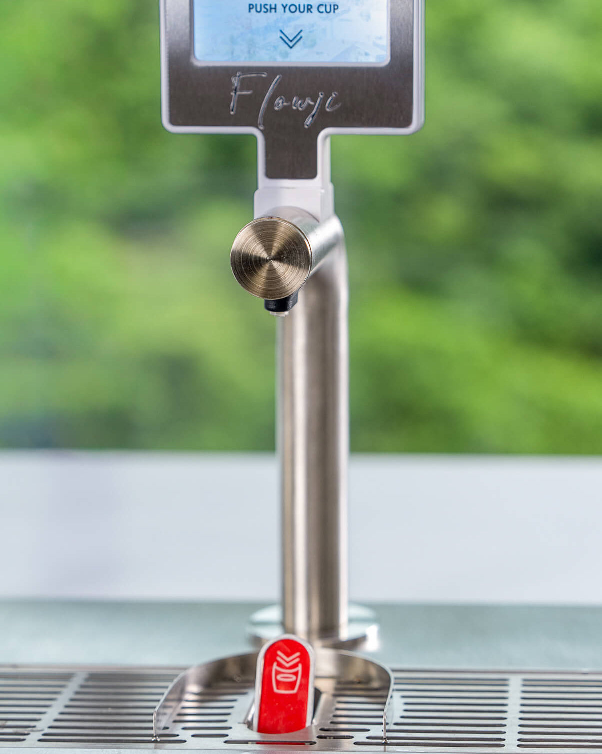 Close-up of the Flowji beverage dispensing tap, showcasing the precision hardware used in the Flowji popup drink cart.